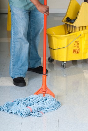 GCS Global Cleaning Services LLC janitor in Fort McDowell, AZ mopping floor.